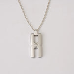 Pendentif Hera O argent rhodié - collier mémoriel avec compartiment pour mèche de cheveux, cadeau unique et précieux