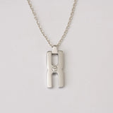 Pendentif Hera O argent rhodié - collier mémoriel avec compartiment pour mèche de cheveux, cadeau unique et précieux