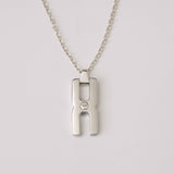 Collier Hera O personnalisé en argent rhodié pour femme, création artisanale française Alhiage avec pendentif anneau